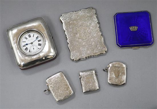 A George V silver mounted travelling timepiece, fitted with a base metal pocket watch, an Edwardian silver card